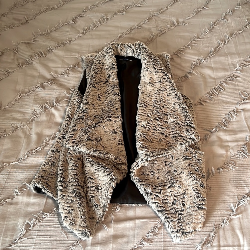 Grey fur vest.